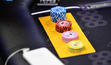 poker table with pile of chips